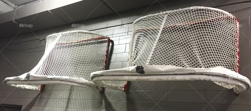 Hockey Nets on Wall. Hockey season over, the nets are hung on the wall at the arena. 