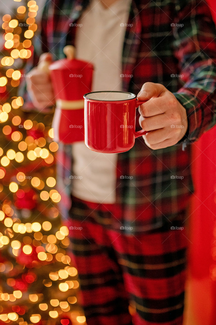 cup of coffee in a cozy festive Christmas atmosphere