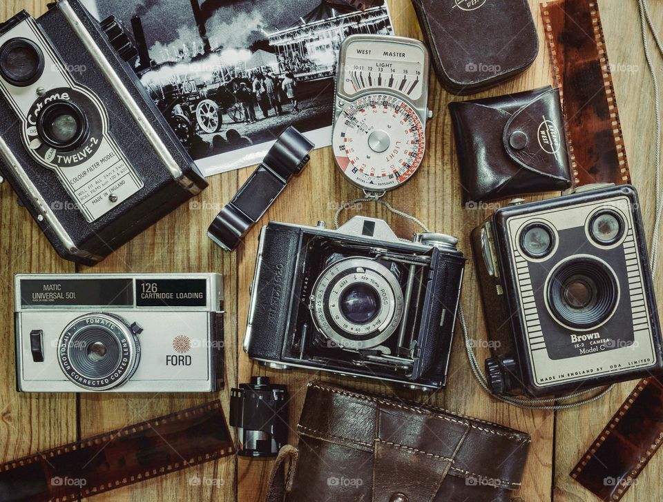 An assortment of old cameras and analogue film & accessories 