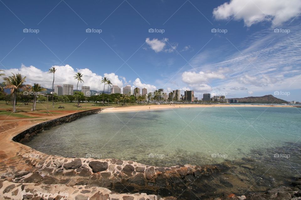 Ocean, Waikiki & Diamond Head . Strolling along the lagoon at Ala Moana Beach outside of Waikiki. Diamond head is in the distance.