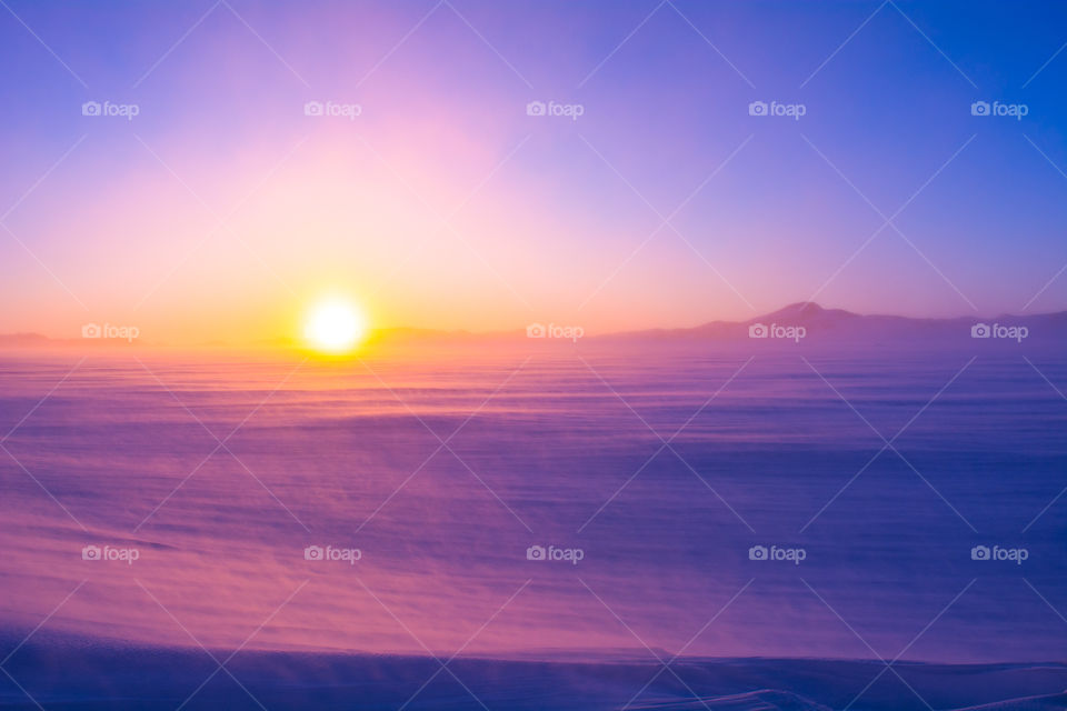 Foggy morning sunrise with wind at antarctica 