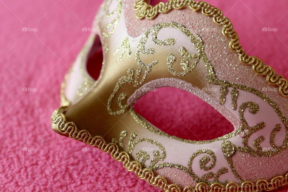 Pink and gold carnival mask
