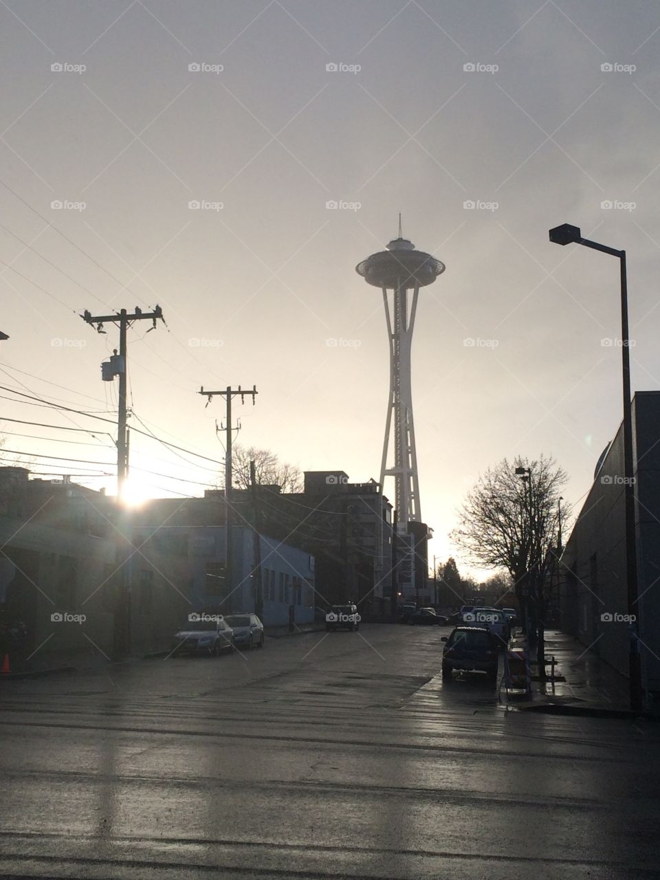 The Seattle Space Needle seen in a wet sunset haze.