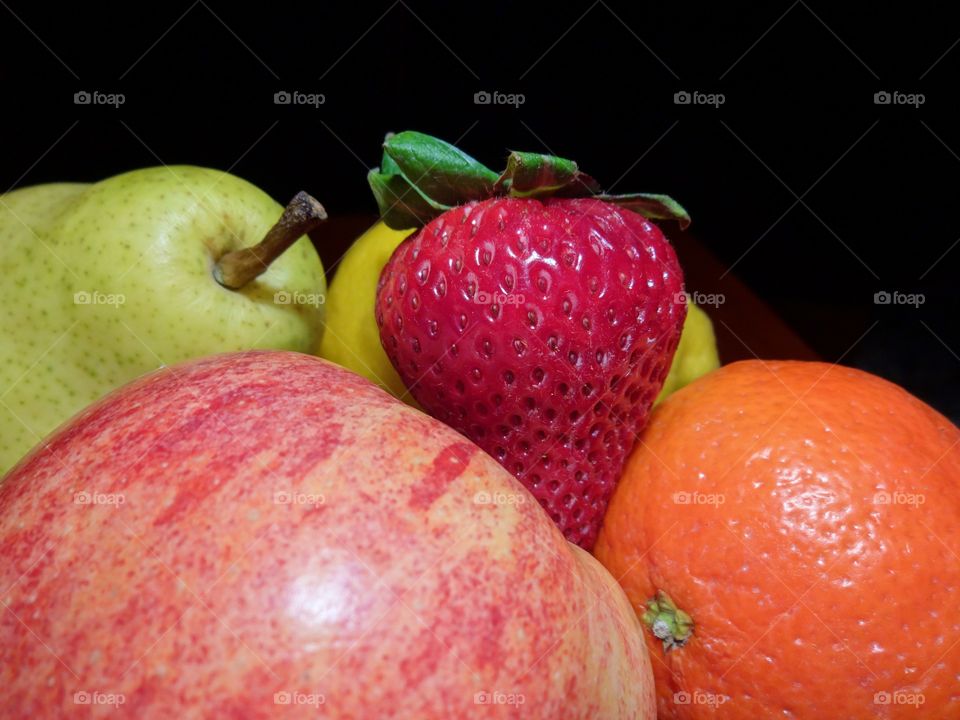 Fruit in the Dark. A photo of various types of fruit with a black background.