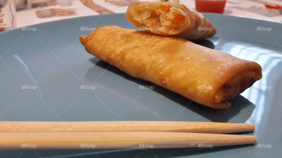 chinese spring rolls and chopsticks
