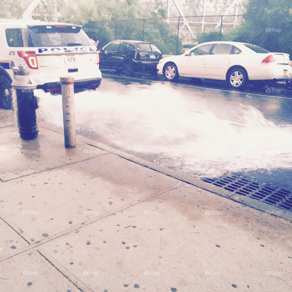Summer in the city. Walking through Harlem, I saw the quintessential New York summer scene, an open fire hydrant