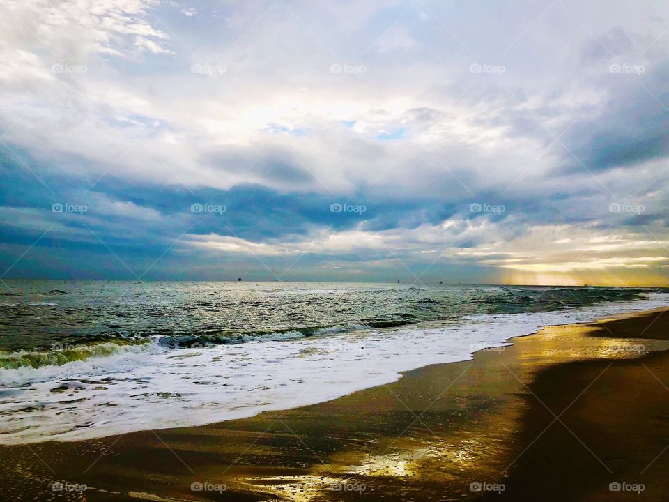 Sunset with reflection on the beach 