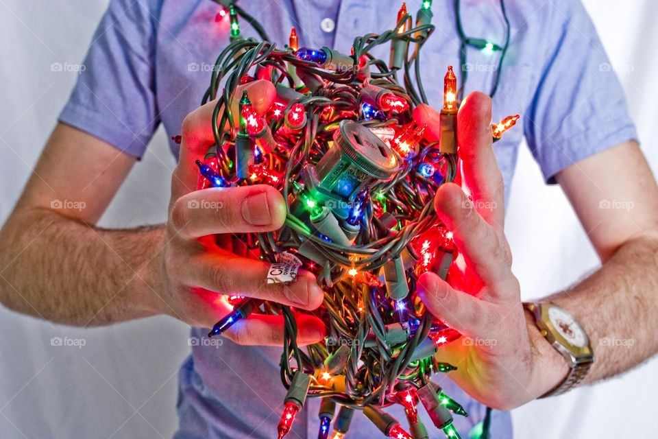 Holding a ball of Christmas lights hdr