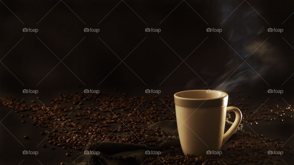 Coffee cup with coffee beans