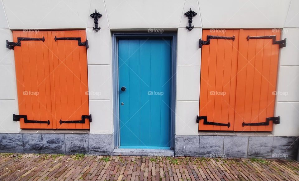 Orange and  blue Doors in the street