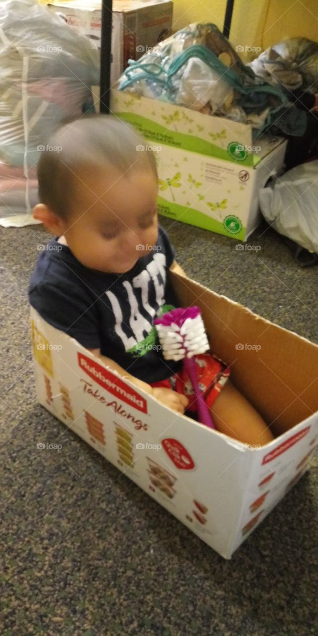 we didn't have money to buy him toy so we made him a box toy